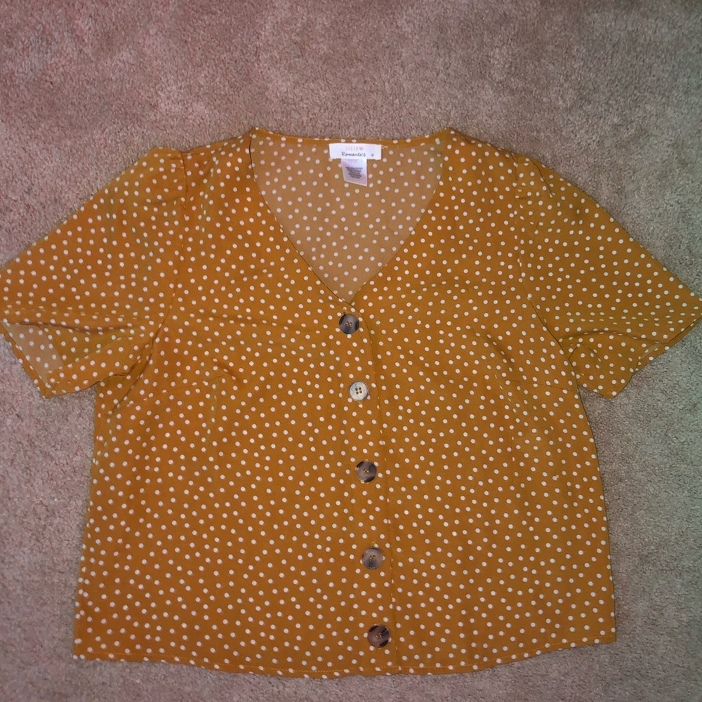 yellow with white polka dots shirt